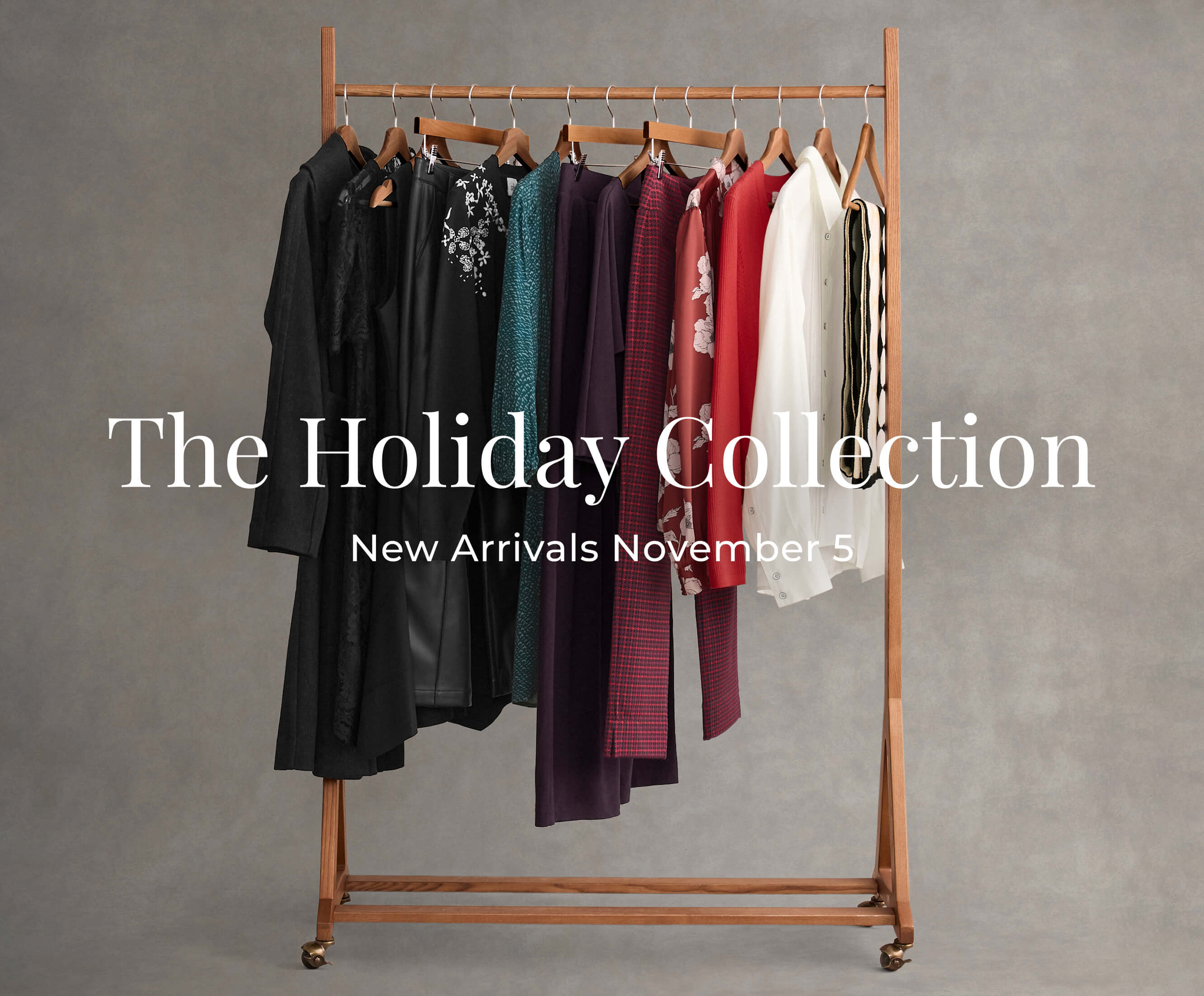 A clothing rack filled with the new Holiday Collection items from cabi.