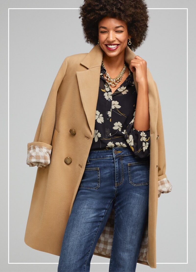 Model wearing the Heritage Coat in Camel, the Cosmo Blouse in Ivory Flower, and the Patch Pocket denim in Trader Wash.