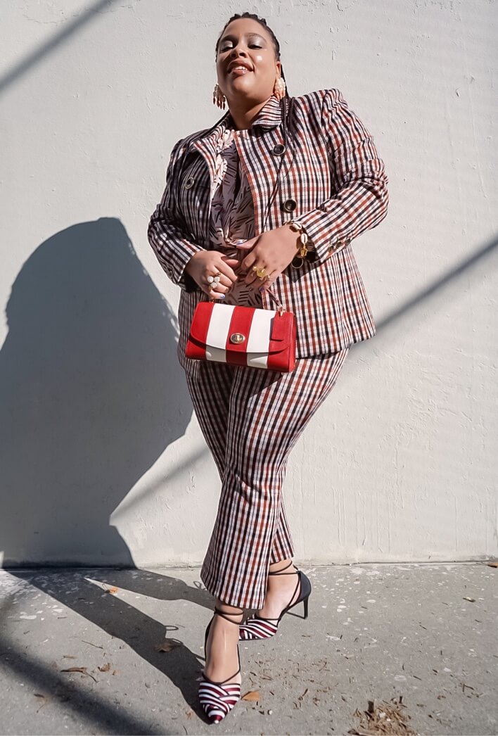 Fashion influencer the Jazzy Jacket in Toffee Plaid, Jazzy Kick Flare in Toffee Plaid, Marni Blouse in Line Art Print, and statement accessories.