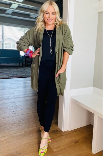 Stylist wearing the Trinity Stitch Cardigan in Olive, Complete Top in Black, M'Leggings in Black, Coy Scarf in Multi, Stirrup Necklace in Antique Silver