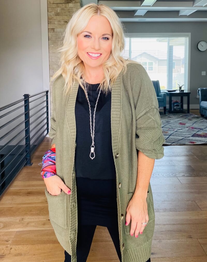 Stylist wearing the Trinity Stitch Cardigan in Olive, Complete Top in Black, M'Leggings in Black, Coy Scarf in Multi, Stirrup Necklace in Antique Silver