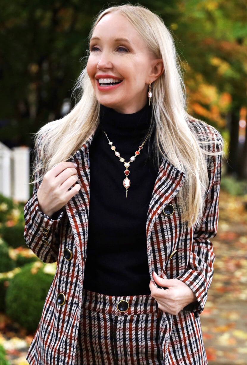Fashion influencer wearing the Jazzy Jacket in Toffee Plaid, Jazzy Kick Flare in Toffee Plaid, Cameo Necklace in Multi, and Cameo Earrings in Multi.