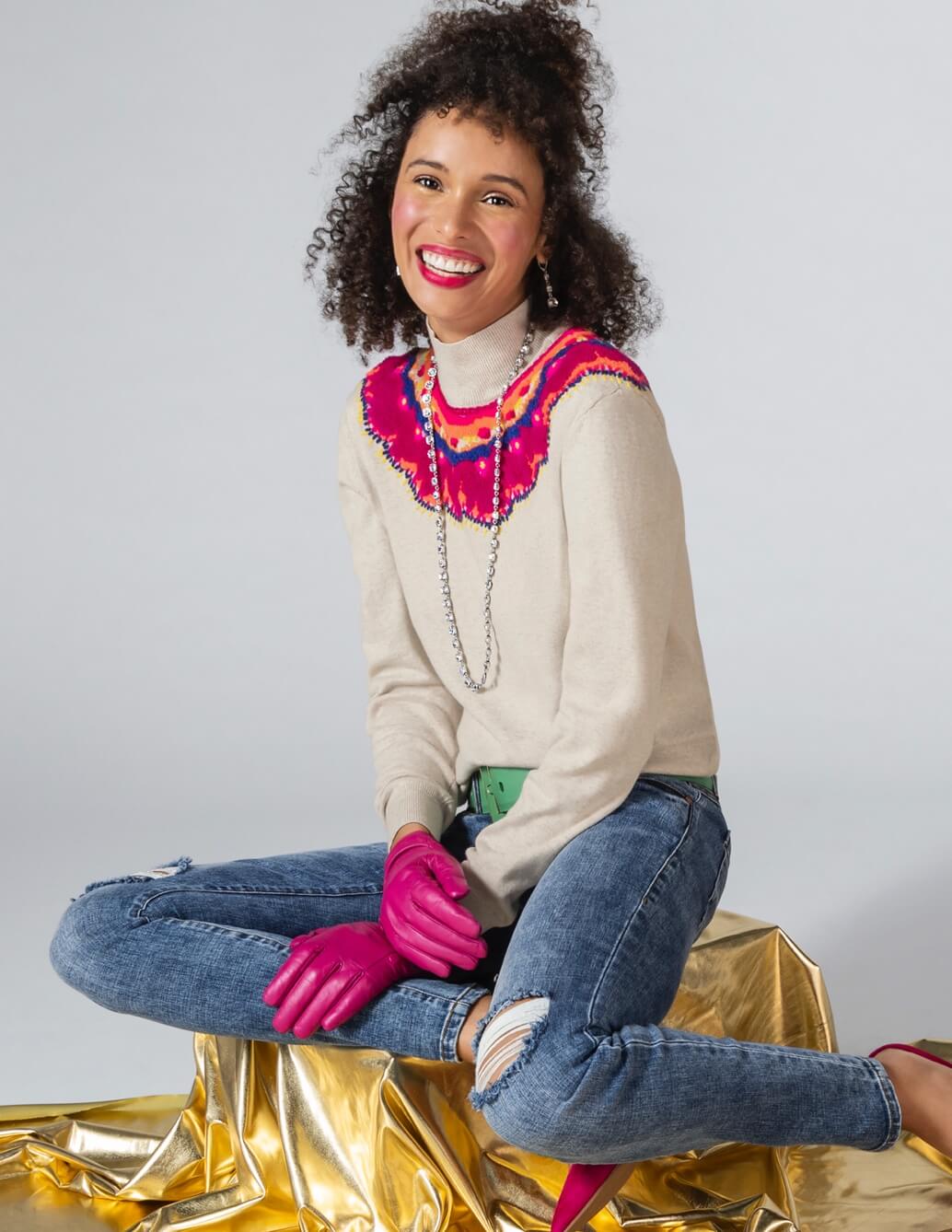 Model Wearing Winsome Pullover in Multi, The Skinny in Vintage Blue Wash, Stellar Necklace in Silver, and Stellar Earrings in Silver.