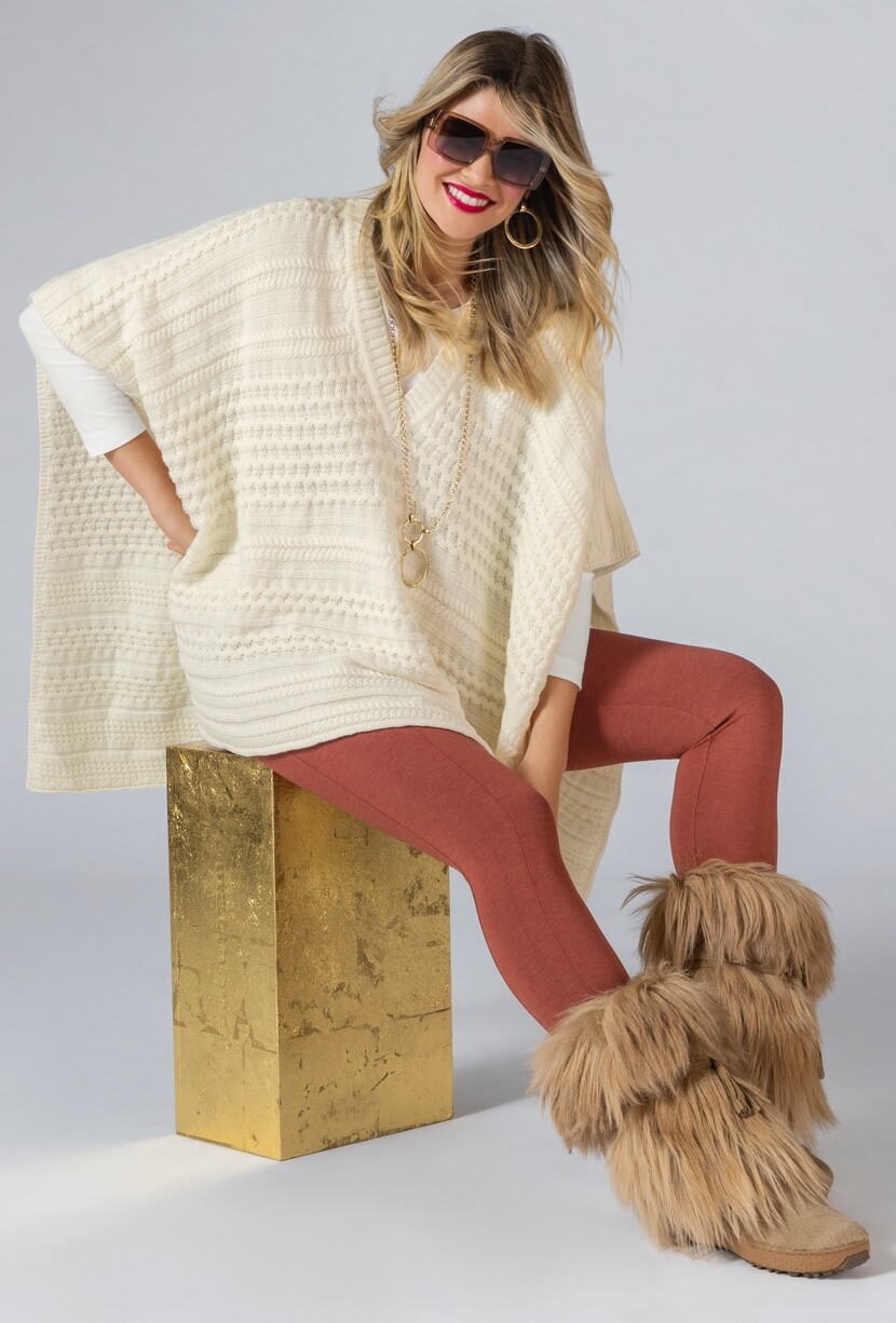 Model Wearing Winter Poncho in Winter White, Classic Tee in White, Lean Legging in Heather Amber, Flashback Necklace in Gold, and Flashback Earrings in Gold.