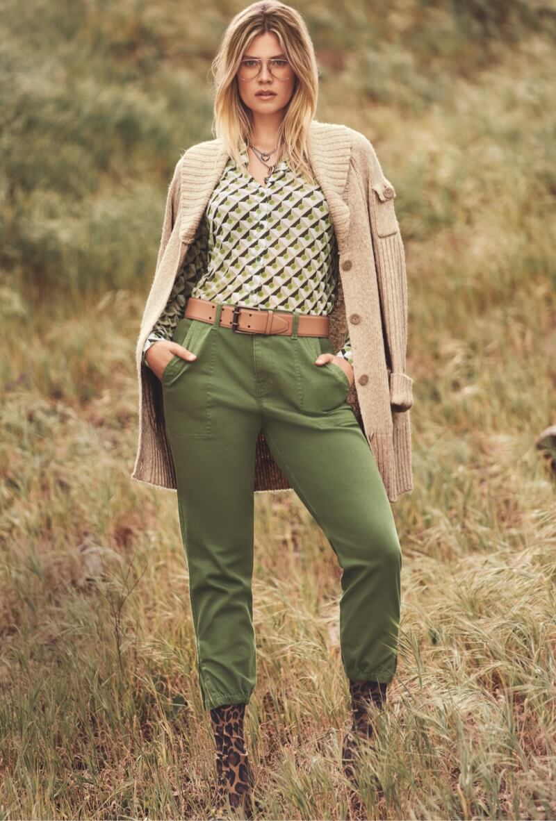 Model wearing Steady Cardigan in Wheat, Mosaic Mesh Top in Tile Print, Compass Pant in Army Green, and Jaguar Necklace in Gold