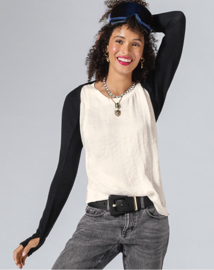 Model Wearing Arm Warmers in Black, Complete Top in White, 100% Boyfriend in Smoke Wash, Jaguar Earrings in Gold, Jaguar Necklace in Gold, Dazzle Necklace in Silver