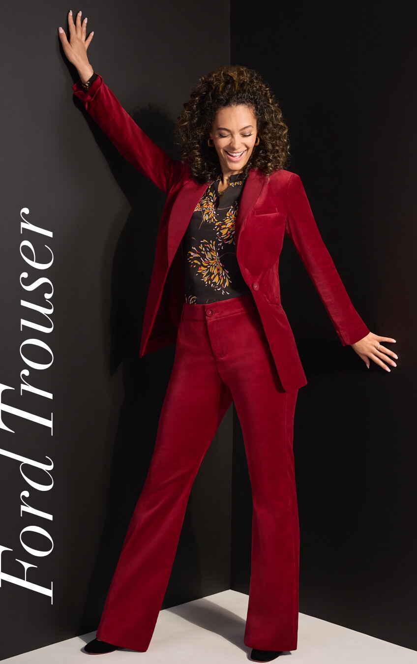 Model wearing Ford Jacket in Cherry, Ford Trousers in Cherry, and the Fiesta Blouse in Starflower.