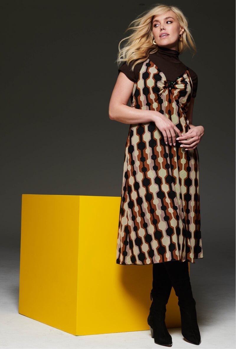 Model wearing Trophy Dress in Mixed Print, Slinky Turtleneck in Chocolate, Dream Earrings in Gold