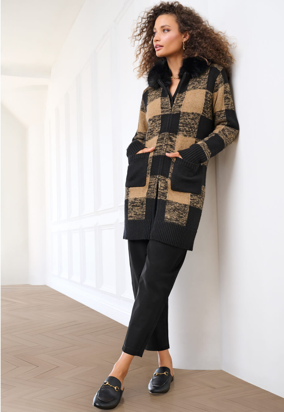 Model wearing Hot Toddy Cardigan in Checkerboard, Composer Top in Black, Chilling Pant in Black, and Alias Necklace in Gold.