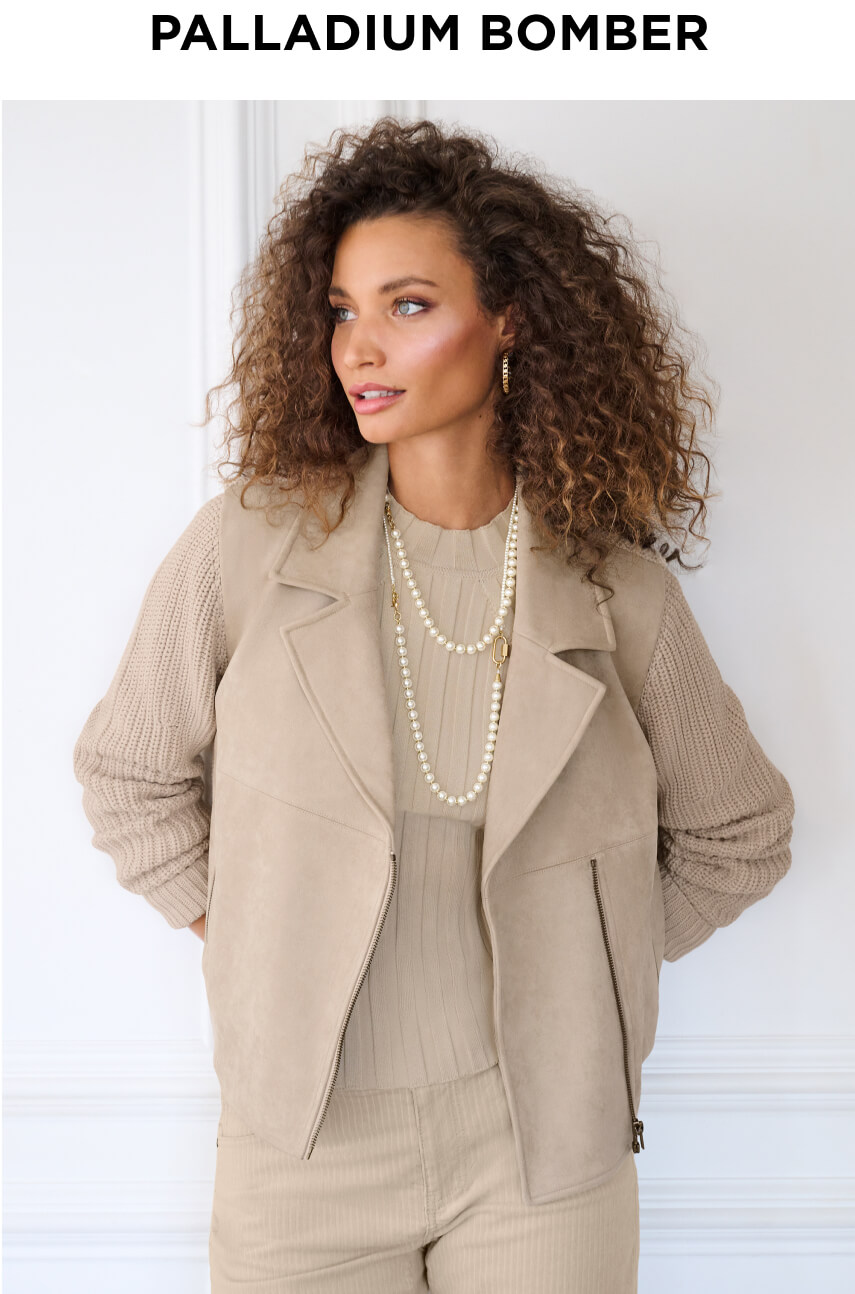 Model wearing Palladium Bomber in Platinum, Contour Turtleneck Platinum, Asher Corduroy Pant in Platinum, Chain Hoop Earrings in Gold, and Superstar Necklace in Gold.