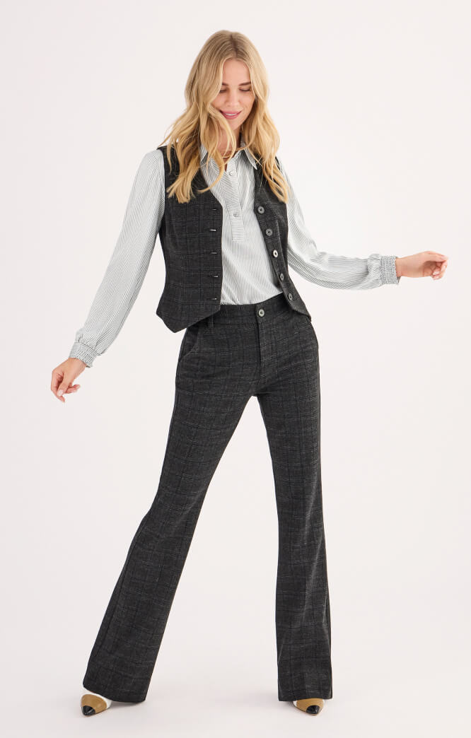 Model wearing Swagger Vest in Plaid, Classy Blouse in Black and White, and Swagger Trouser in Plaid.