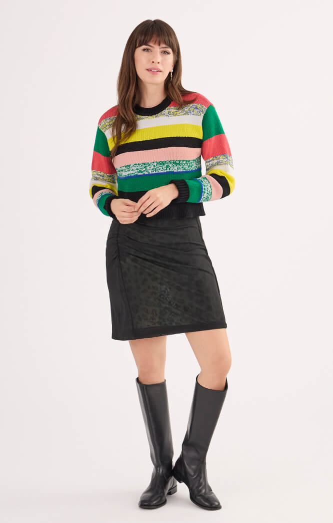 Model wearing Pop Crop Pullover in Multi Stripe, and Quest Dress in Skin.