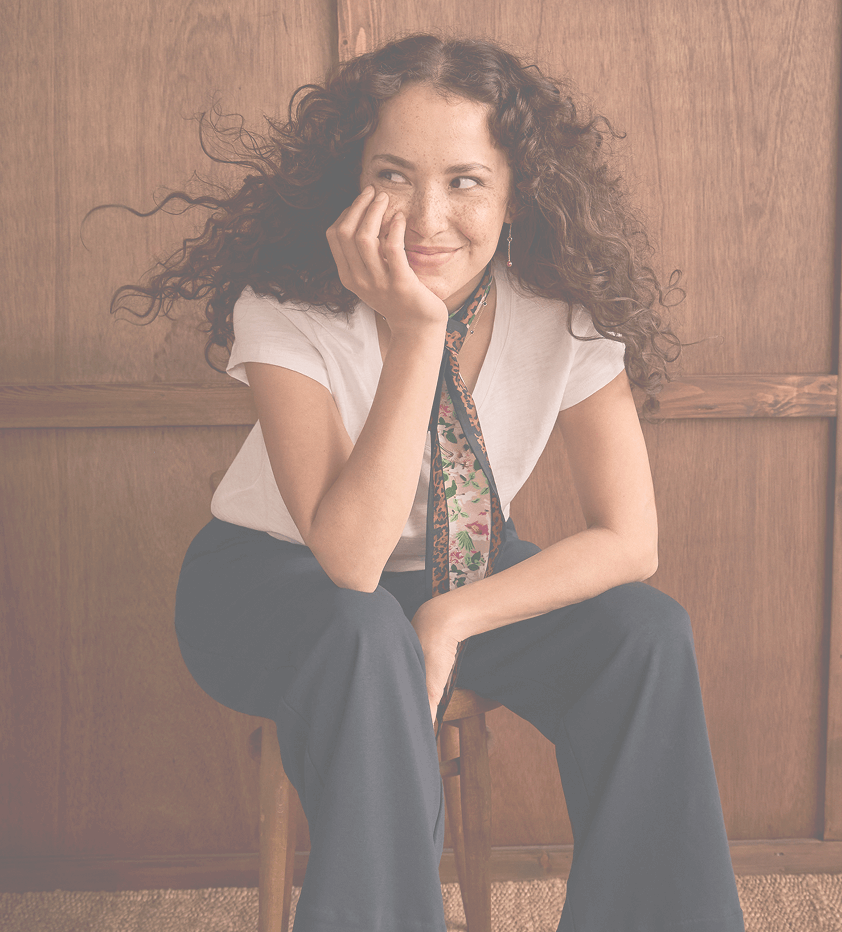 A model wearing the V-Neck Tee with the Cheeky Pant and the Simone Scarf from the new Fall 2025 Collection