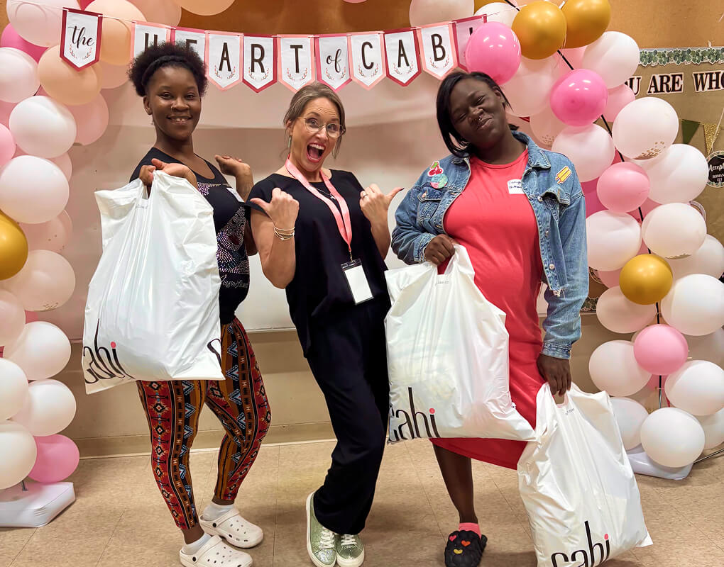 3 women attending a Heart of cabi Foundation Love Local Event.